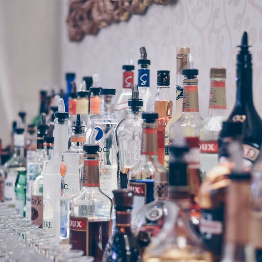 moderate drinking liquor bottles displayed in a bar